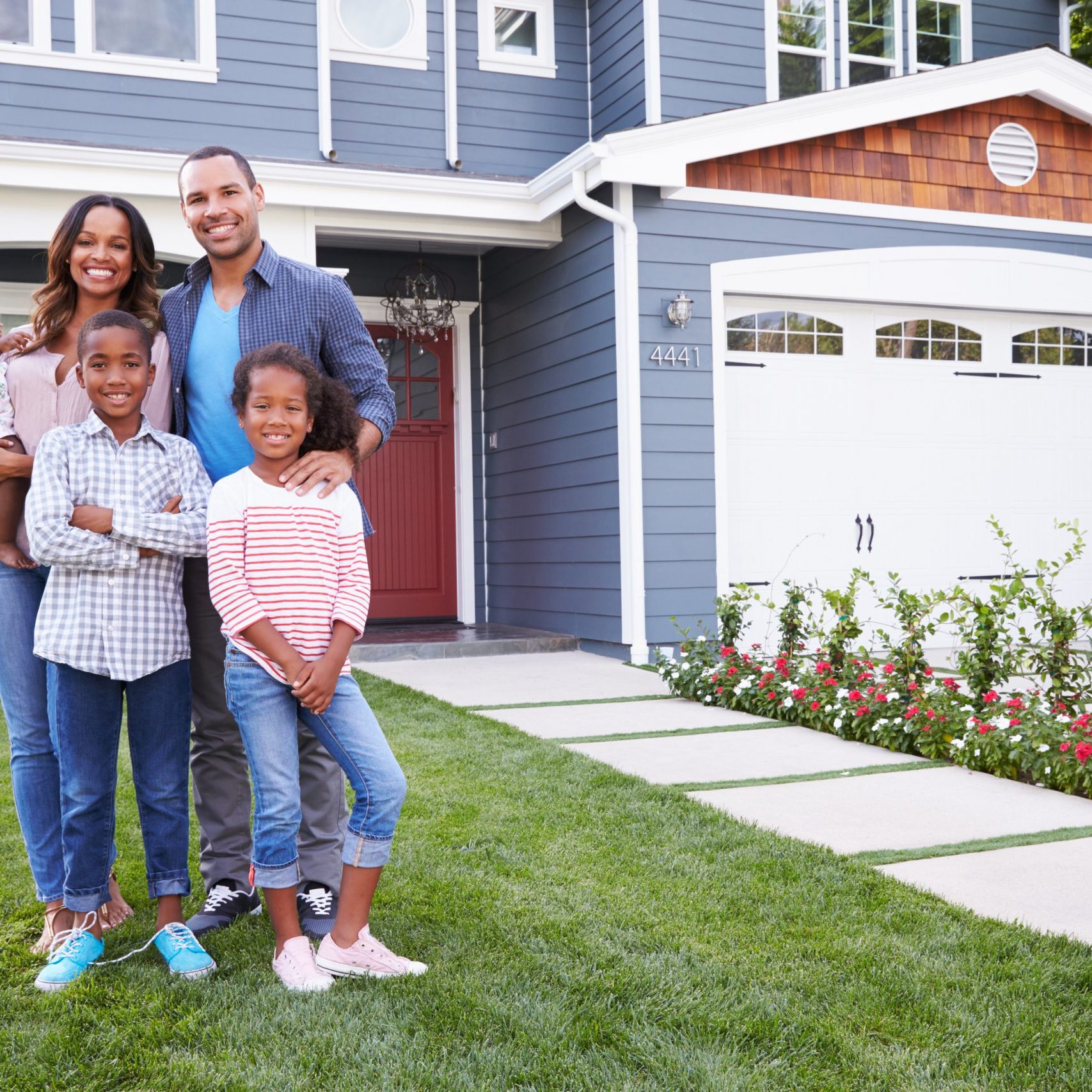 Happy,Black,Family,Standing,Outside,Their,House